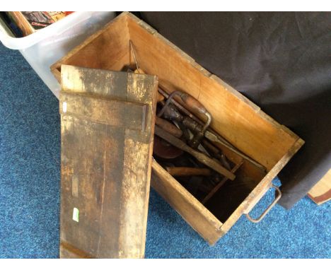 A set of tools in a wooden box.