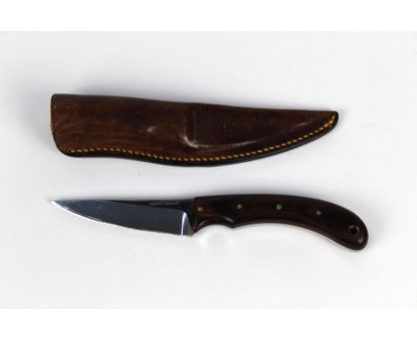 Harry Boden a fixed blade knife, with 3 1/2" hollow grind blade, stamped Harry Boden with hardwood scales.  Overall length 20