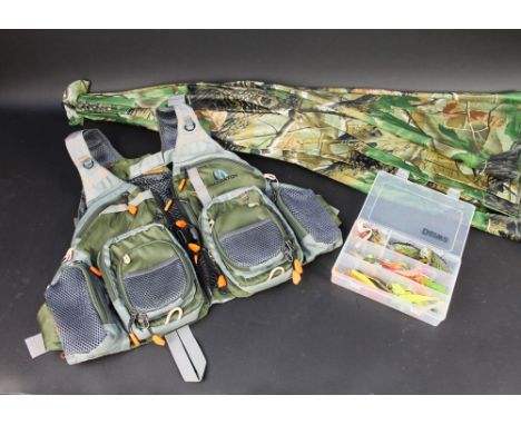 A camouflage fishing umbrella, together with a fly fishing vest and Daiwa tackle box filled with various lures.