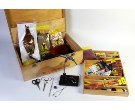 An Anvil Apex fly tying vice, together with a fly tying box filled with materials, tools, hooks etc.