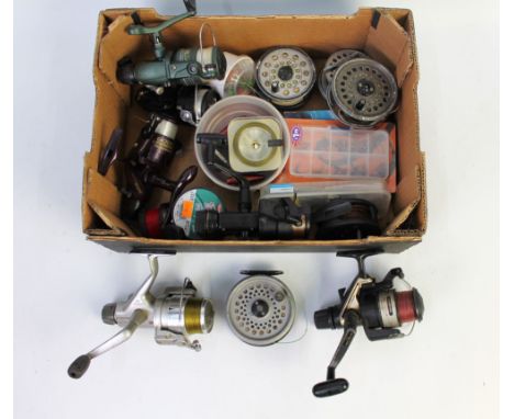 A box of various fixed spool and fly reels, a Shimano custom X and Shimano GT-R 3500.