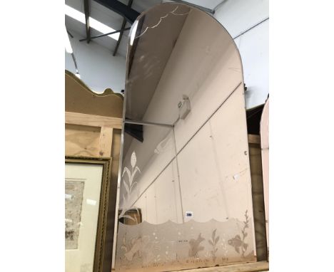 A VINTAGE ROSE COLOURED ETCHED MIRROR OF SHAPED FORM 120 x 61 cms