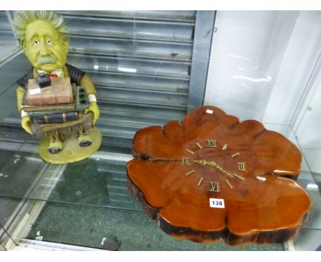 A PETER MOOK ALBERT EINSTEIN TOBACCO HOLDER TOGETHER WITH A BATTERY OPERATED CLOCK SET IN A TREE TRUNK SECTION