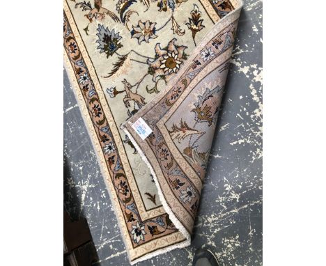 AN ORIENTAL RUNNER OF PERSIAN TABRIZ DESIGN 295 x 85 cms
