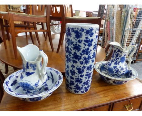 TWO BLUE AND WHITE JUG AND BOWL SETS AND A STICK STAND. 