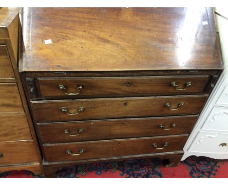 A GEORGE III MAHOGANY BUREAU, THE FALL ABOVE FOUR GRADED LONG DRAWERS AND BRACKET FEET