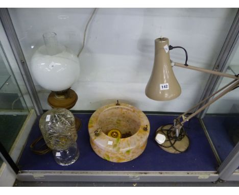 AN ANGLE POISE LAMP, A CUT CLEAR GLASS LAMP AND SHADE, A CEILING LIGHT SHADE AND AN OIL LAMP.