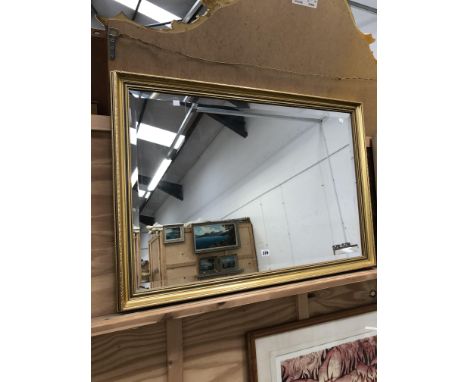 A DECORATIVE GILT BEVEL EDGE MIRROR 68 x 100cms