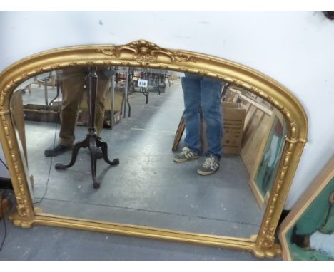 A VICTORIAN STYLE GILT FRAMED OVER MANTLE MIRROR. 