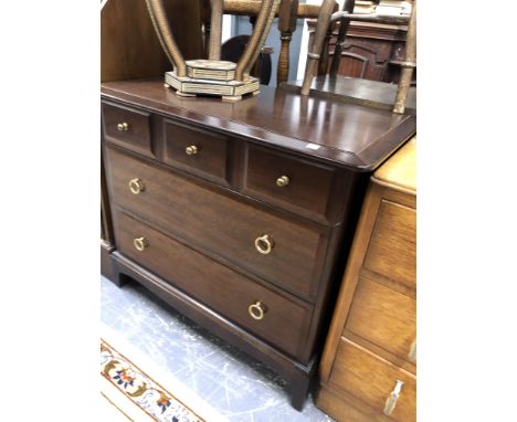 A CO-OPERATIVE SOCIETY ART DECO OAK DRESSING CHEST WITH CIRCULAR MIRROR BACK TOGETHER WITH A MODERN STAG MAHOGANY CHEST OF FI