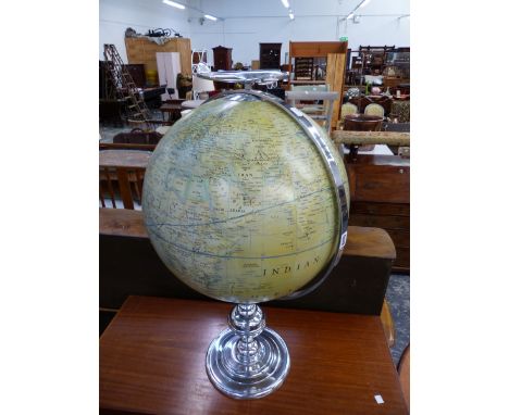 A LARGE GLOBE ON SILVERED STAND. 