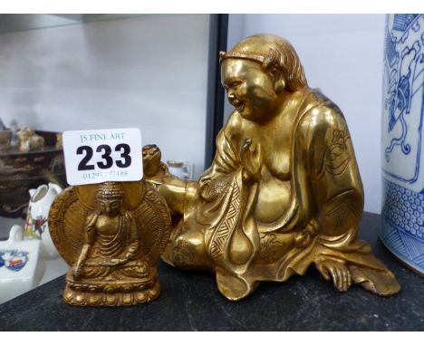 A GILT BRONZE ORIENTAL DEITY AND ANOTHER SMALLER EXAMPLE