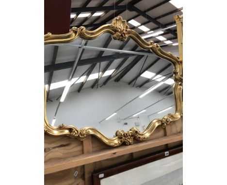 A DECORATIVE GILT FRAMED MIRROR, H 79cms W 100cms