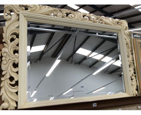 A DECORATIVE LARGE BEVELLED EDGE MIRROR, 90 x 124cms