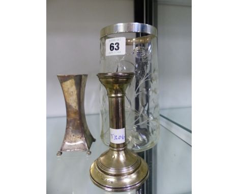 A HALLMARKED SILVER RIMMED CUT GLASS VASE, A SMALL SILVER CANDLE STICK AND A SQUARE FORM BUD VASE. 