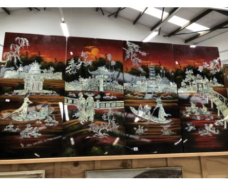A DECORATIVE EASTERN FOUR PANEL LACQUERED SCREEN. OVERALL SIZE 98 x 195cms