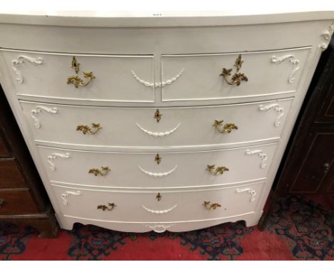 A WHITE PAINTED BOW FRONT CHEST OF TWO SHORT AND THREE GRADED LONG DRAWERS.   W 103 x D 51.5 x H 107cms.