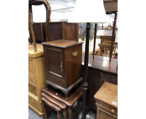 A NEST OF THREE MAHOGANY TABLES, A STANDARD LAMP AND A MAHOGANY BEDSIDE CUPBOARD
