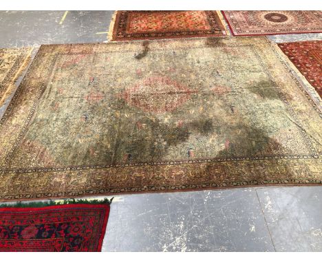 A VINTAGE MACHINE MADE CARPET OF PERSIAN HUNTING DESIGN 483 x 357cms