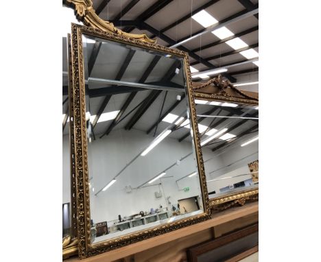 A GILT FRAMED BEVEL EDGED NEO-CLASSICAL STYLE MIRROR, H 76 W 96cms, TOGETHER WITH A SMALLER SIMILAR MIRROR (2)