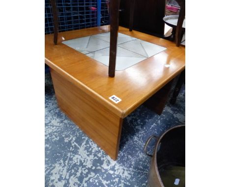 A TEAK AND TILE TOP TABLE. 