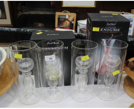 Four glass candle stands and boxed Enigme decanter and wine glasses 