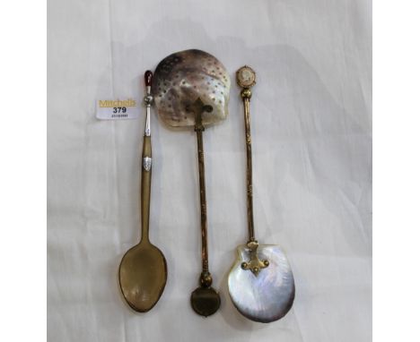 Three vintage spoons, two with mother of pearl bowls 