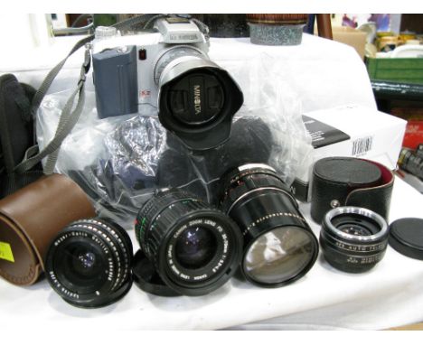 Minolta camera with Minolta AC adapter, 3 lenses by Cannon, Lydith and Pentagon, and teleconverter lens  