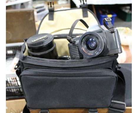 Camera bag containing Cannon T70 camera with Ozeck lens and Tamron 500 mm macro lens etc