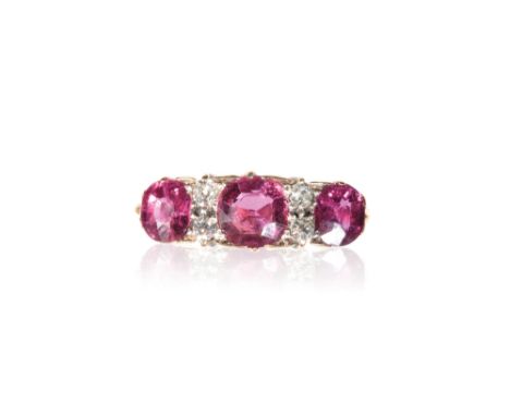 RUBY AND DIAMOND DRESS RING, three round-cut rubies, approx1.80ct total, divided with four diamonds, on an 18ct yellow gold s