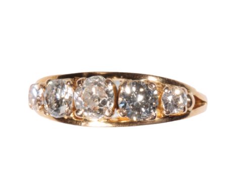 FIVE STONE DIAMOND RING, the centre diamond approx .33 ct, flanked by graduating diamonds, on a yellow gold shank, ring size 