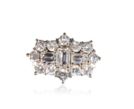 DIAMOND CLUSTER RING, three baguette-cut diamonds, surrounded by round-cut diamonds, raised-set in white gold, on an 18ct yel