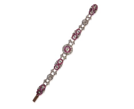 RUBY AND DIAMOND BRACELET, the centre cushion-cut diamond approx .65ct, surrounded by a boarder of rubies and outer border of