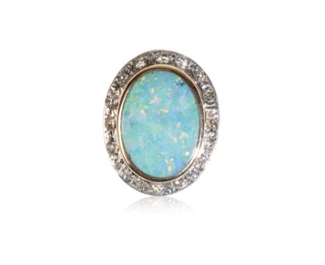 DOUBLET OPAL AND DIAMOND RING, the opal, surrounded by a border of diamonds, on an unmarked yellow metal shank, ring size K-L