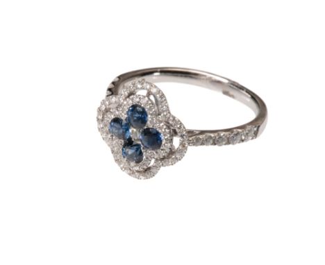 SAPPHIRE AND DIAMOND RING, four round-cut sapphires surrounded by a border and outer border of micro-set diamonds, on an 18k 