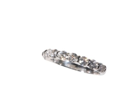 DIAMOND HALF ETERNITY RING, nine brilliant-cut diamonds, on a white gold shank stamped "750", ring size M