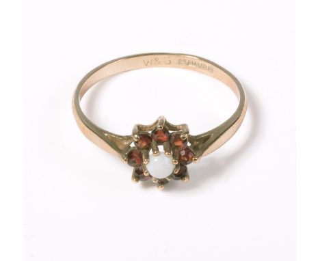 9ct gold ring set with garnets and an opal size P
