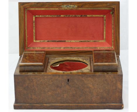 A 19th century Burr Walnut tea caddy, of Sarcophagus form, the lid opening to reveal a fitted interior, 31cm wide
