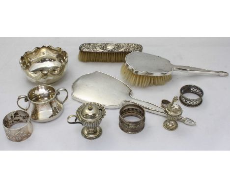 A silver-backed hairbrush and hand mirror with engine-turned decoration, together with a silver-back clothes brush and small 