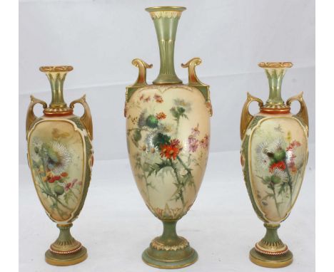 A Royal Worcester garniture of three porcelain vases, the ovoid bodies painted with flowers to a blush ivory ground with gilt