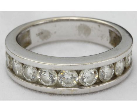 An 18k white gold and diamond ring, plain band channel-set with eleven RBC diamonds estimated 1.5 carats, total item weight 6