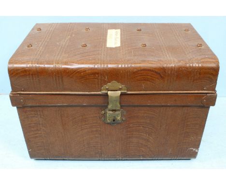 A metal storage trunk with brass catch and simulated ribbed and studded decoration. 64cm.