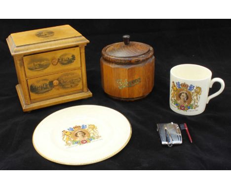 A small, Mauchline ware chest of two drawers, together with a wooden tobacco pot, a Ronson 'varaflame' lighter and an ER II c