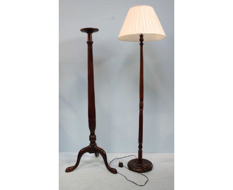 A mahogany torchere stand, the circular platform raised on a turned and reeded support to tripod base, 157cm high, together w
