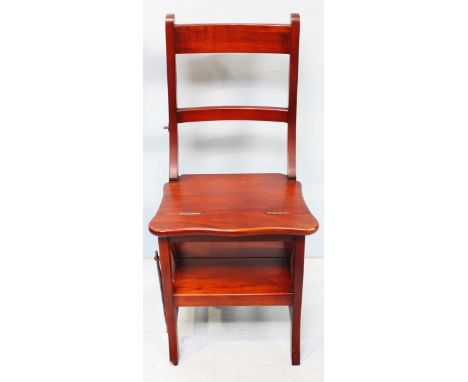 A set of stained-wood, metamorphic library step, folding out to create a standard chair.