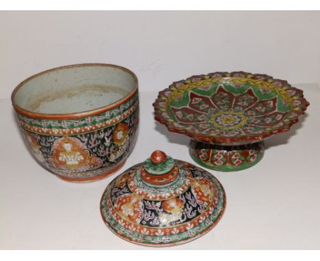 A Chinese porcelain bowl decorated with panels of deities on a dark green ground, rust red borders, 6” diameter together with