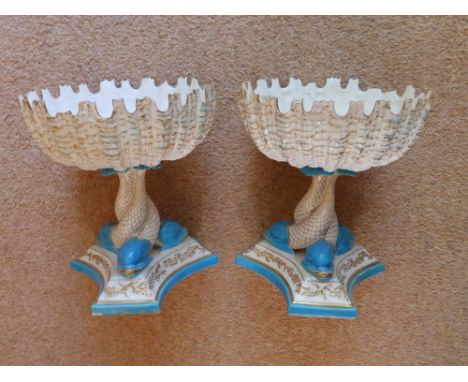 A pair of Royal Worcester dolphin pedestal bowls, 7.5” high – both damaged.