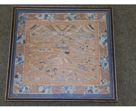 A Chinese silk embroidered panel depicting a phoenix above waves, 15” x 15.5”.
