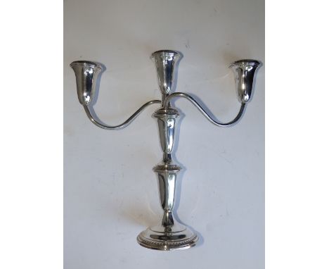 An Empire 'Sterling' three-light metamorphic candelabrum.