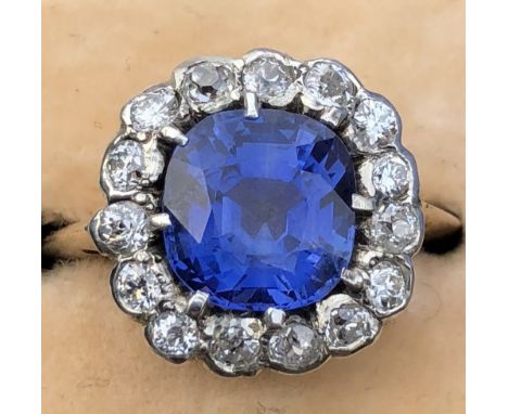 A late 19thC certified natural Sri-Lankan sapphire & diamond cluster ring in yellow gold with silver settings, the 3.21 carat